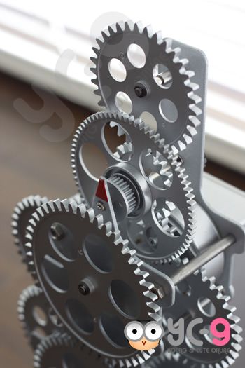   clock red font this gear wall clock has several small gears running