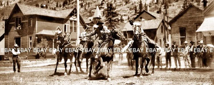 PHOTO OF EARLY 1900S COWBOYS PLAYING COWBOY POLO ON THE MAIN STREET 