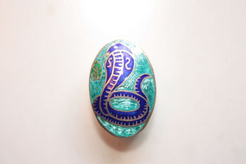 Sterling pillbox with blue enamel featuring a cobra, marked 