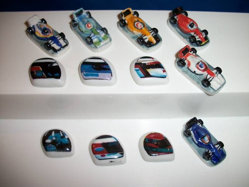 FORMULA ONE Set 12 FEVES Porcelain RACE CARS HELMETS  