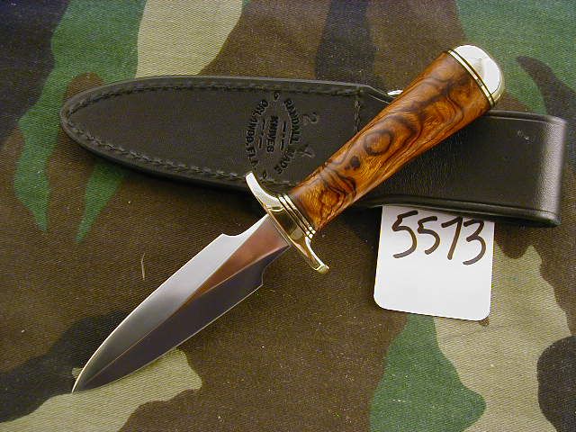 handle in concave shape brass butt domed and black sheath call steve 